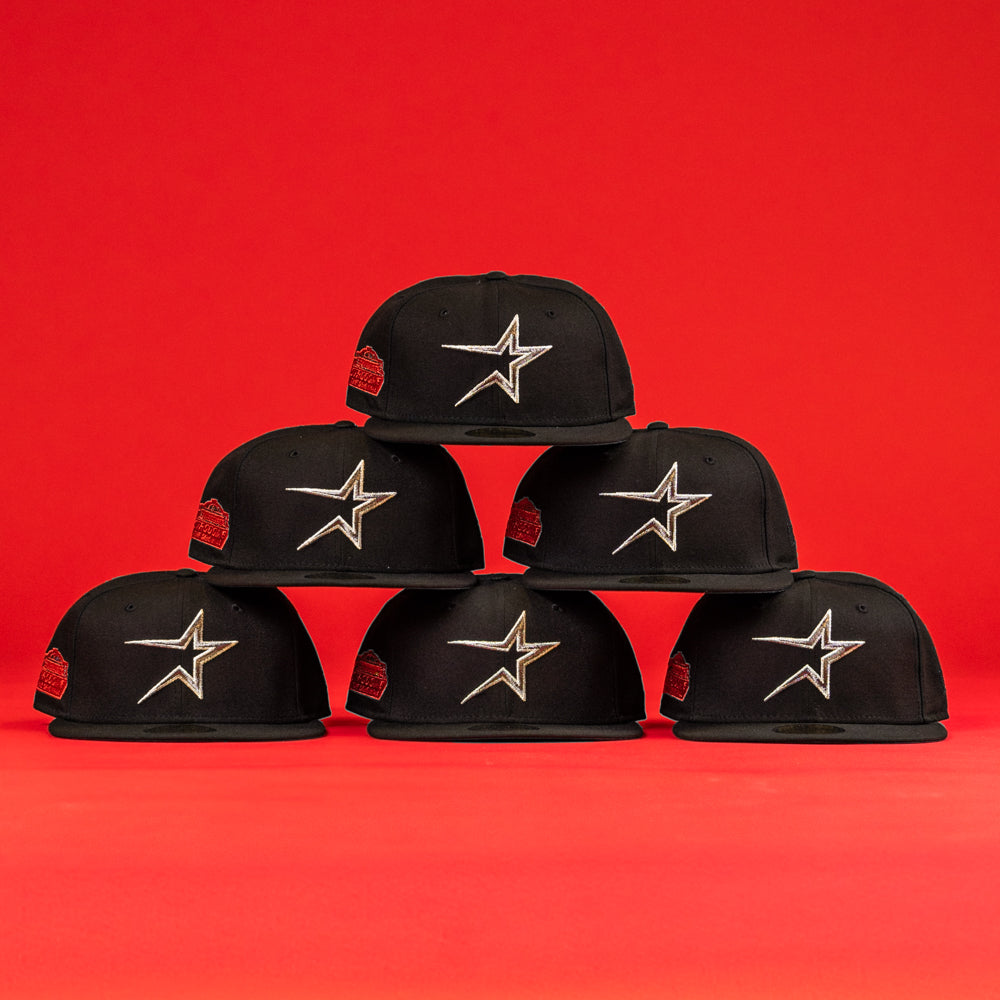 Six The Shootah Black Silver New Era Hat 5950 Fitted caps are arranged in a pyramid shape, each displaying a silver star logo, set against a bright red background.