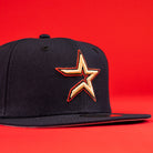 The 6am in Texas Navy Red White New Era Hat 5950 Fitted features a bold star logo embroidered in yellow and red, set on the front, and is showcased against a vibrant red background.