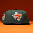 The El Jager Mountain Orange New Era Hat 5950 Fitted features a green design with an embroidered Texas outline and orange star on the front, set against an orange background—perfect for showcasing your state pride in style.