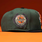 The El Jager Mountain Orange New Era Hat 5950 Fitted features a colorful embroidered patch and stands out with its bold orange color.