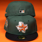 Two El Jager Mountain Orange New Era Hat 5950 Fitted caps with black brims sit on an orange background. The front shows a Texas outline with an orange star and colorful side patch; the back displays an MLB logo.
