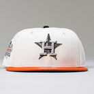 The Orange Soda New Era WS22 Houston Astros 5950 Fitted Hat features a white crown, orange brim, black star, and silver H logo on the front, with a partial World Series patch on the side for added team pride and style.