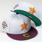 Two Shibuya Lights New Era Silver Japan Houston Astros 5950 Fitted Hats are shown, both featuring maroon brims, green undersides, the Astros logo on the front, and an All-Star Game patch on the side. One cap rests atop the other.