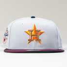 A silver Shibuya Lights New Era 5950 Fitted Hat featuring the Houston Astros gold and orange star logo with an H on the front and a commemorative patch on the side.