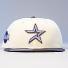 The Dark:30 New Era Chrome Black Camo Houston Astros 5950 Fitted Hat features a cream color, bold embroidered star with blue and gold outline on the front, gray brim, and a side patch, honoring the Astros in standout style.