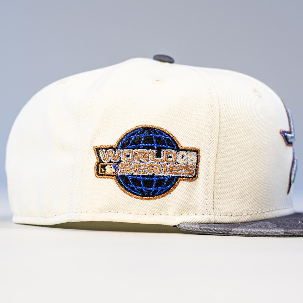 The Dark:30 New Era Chrome Black Camo Houston Astros 5950 Fitted Hat features a unique camo design with a stylish logo patch on the side and a gray brim, blending modern edge with classic Astros style.