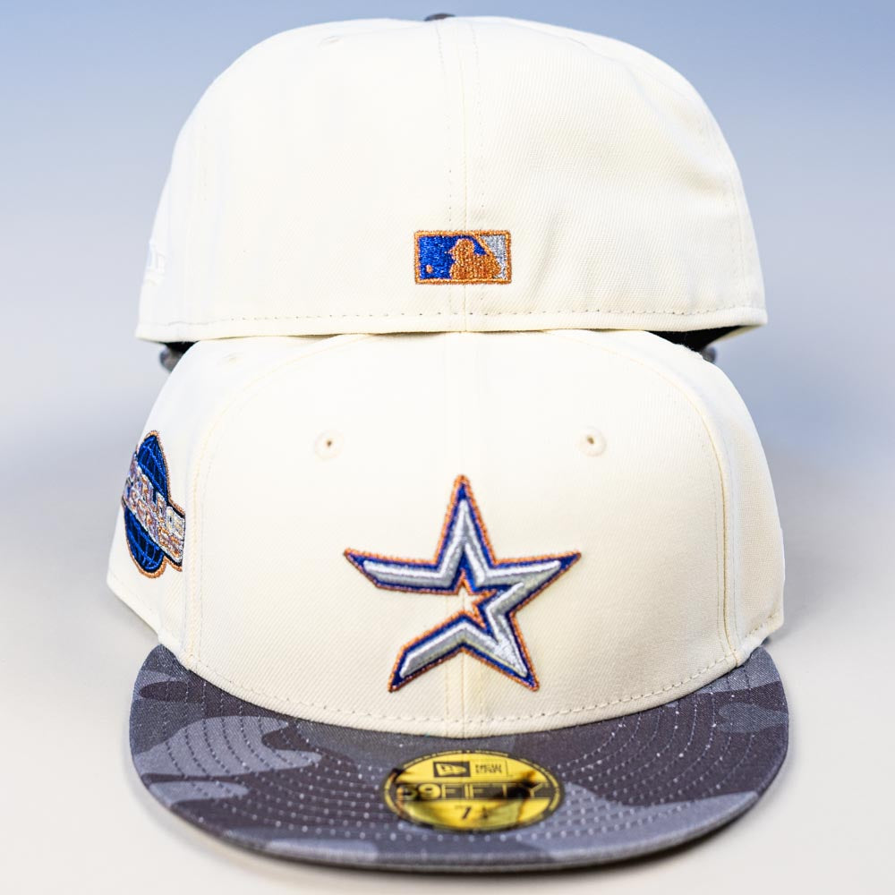 Two Dark:30 New Era Chrome Black Camo Houston Astros 5950 Fitted Hats are stacked. The front hat has a blue and orange Astros star logo, a gray Chrome Black Camo brim, circular side patch, and the back features an MLB logo patch.