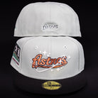 Two light grey Pixie Dust New 2000 Houston Astros New Era 5950 Fitted caps with black brims are shown. The front features a sparkly Astros logo, while the back displays smaller embroidered Astros text. Both are authentic New Era hats.