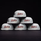Six Pixie Dust New 2000 Houston Astros New Era Hat 5950 Fitted caps in light gray are arranged in a pyramid against a black background, each featuring side embroidered patches.
