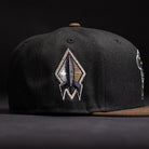 The Midnight Cowboy Sugarland Space Cowboys New Era Hat 5950 Fitted is a black cap with an embroidered rocket ship patch—an ideal accessory for Space Cowboys.