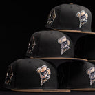 Five Midnight Cowboy Sugarland Space Cowboys New Era Hat 5950 Fitted caps with brown brims are stacked in a pyramid, each featuring embroidered Space Cowboys mascot and geometric logos on a sleek black background.