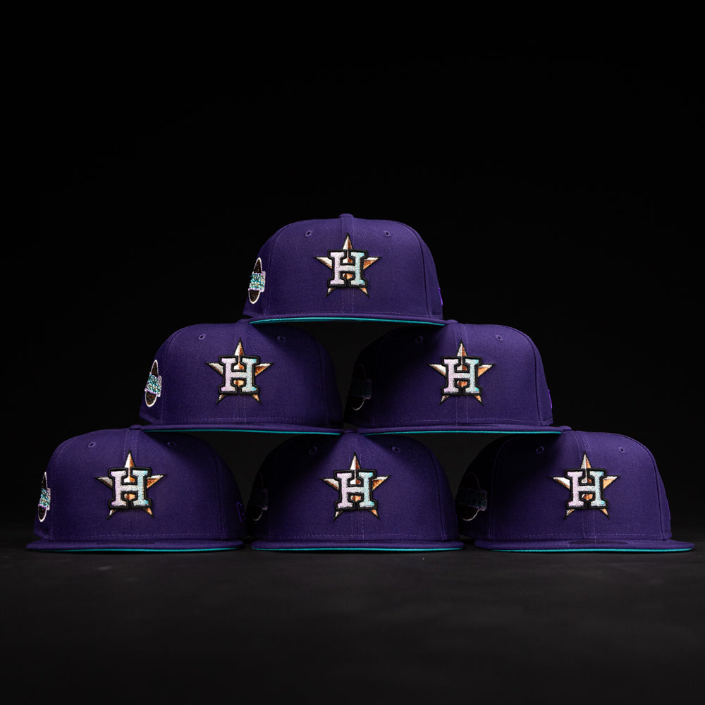 Six DAY N HOU Rushmore WS05 Purple Teal Houston Astros New Era 5950 Fitted hats, each featuring a star and H logo, teal brims, and side patch, are arranged in a pyramid against a black background.