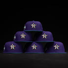 Six DAY N HOU Rushmore WS05 Purple Teal Houston Astros New Era 5950 Fitted hats, each featuring a star and H logo, teal brims, and side patch, are arranged in a pyramid against a black background.