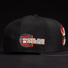 The La Flame Rushmore WS05 Fire Black Houston Astros New Era 5950 Fitted Hat features a black design with an embroidered World Series logo and a red dragon wrapped around a baseball on the side.