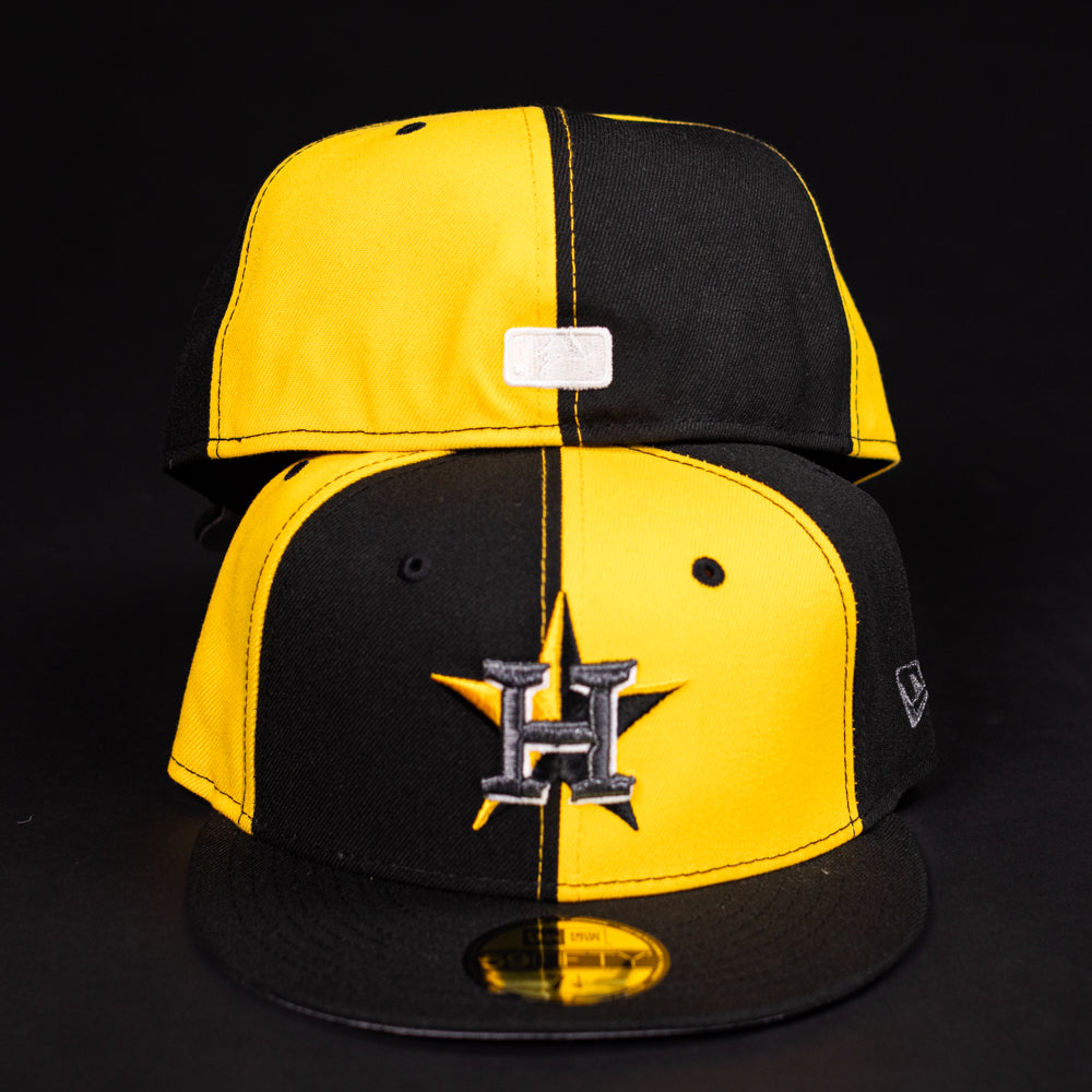 Two Hazmat Rushmore Gold Black Pinwheel Houston Astros New Era 5950 Fitted hats are shown; the front displays the Astros H star logo, while the back reveals a rectangular patch. Both caps are set against a black background.