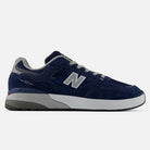 A side profile of the Andrew Reynolds New Balance Numeric 933 LNV Skateboarding Shoe in navy slate gray is displayed on a white background. This sneaker features a combination of suede and mesh materials, highlighted by a white midsole and gray outsole. The design incorporates heritage-inspired details and offers premium cushioning for all-day comfort.