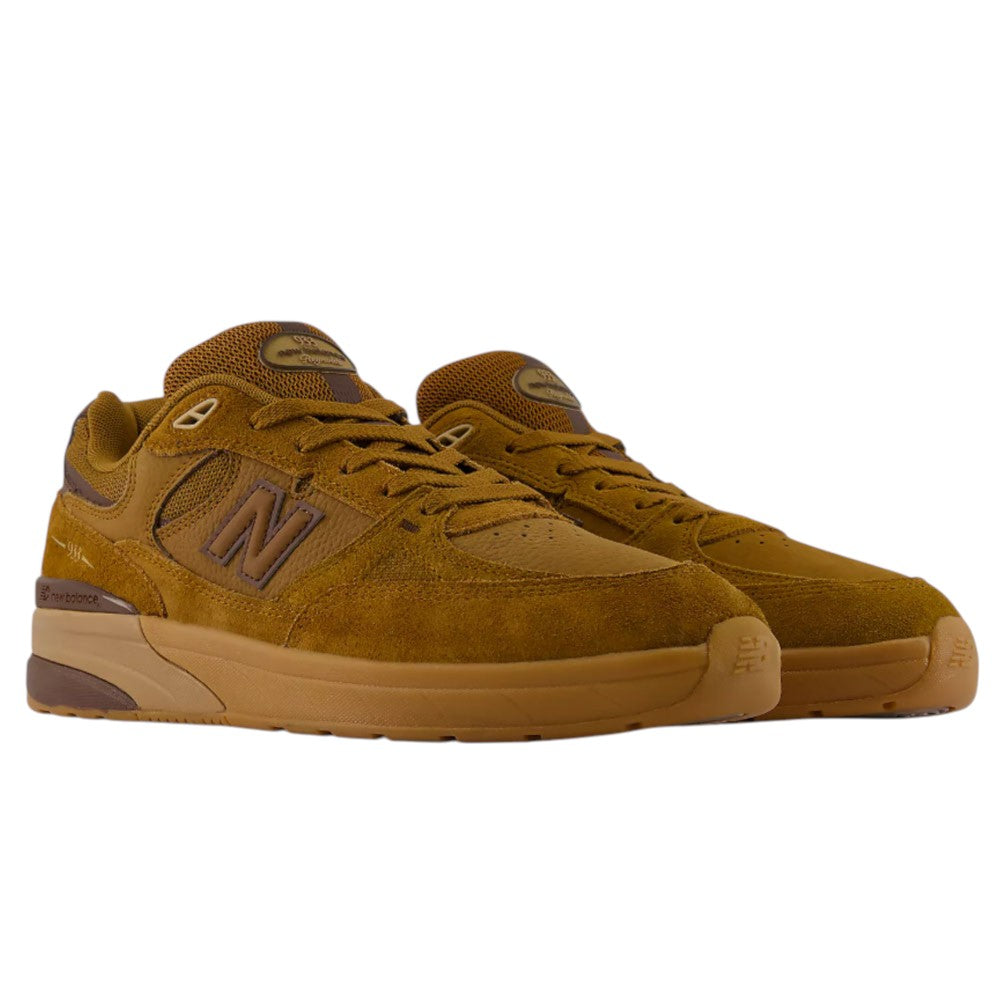 A pair of 933 LRO Andrew Reynolds New Balance Numeric Suede Skateboarding Shoes, featuring brown suede and mesh uppers, brown laces, rubber soles, and an ABZORB midsole for superior cushioning, displayed against a plain white background.