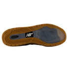 The image shows the sole of the 933 LRO Andrew Reynolds New Balance Numeric Suede Skateboarding Shoe, featuring a gum-colored tread with a white NB logo at the center, evoking the classic heritage style of New Balance running shoes.