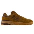A brown WIDE 933 LRO Andrew Reynolds New Balance Numeric suede skateboarding shoe is shown in profile, featuring suede and mesh materials, a prominent N logo on the side, an ABZORB midsole for enhanced cushioning, and a two-tone tan and brown rubber sole.