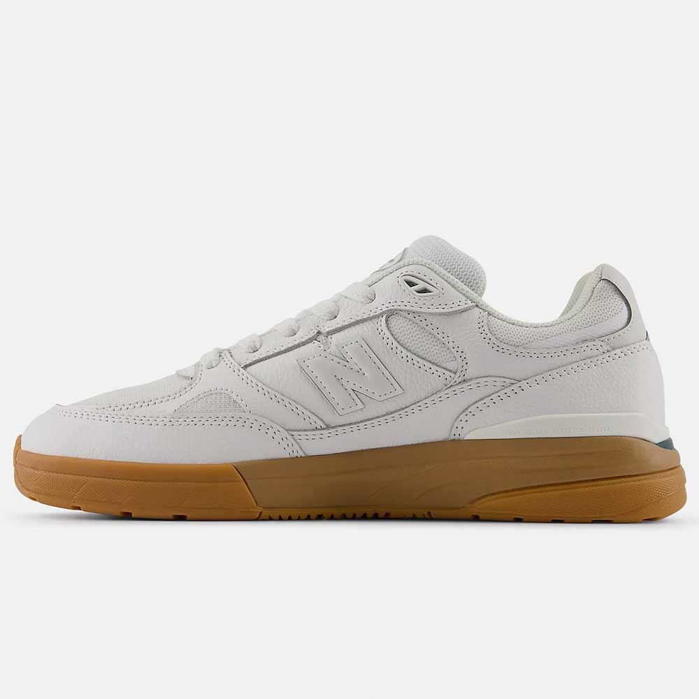 The 933 WWB White Black Andrew Reynolds New Balance Numeric Suede Skateboarding Shoe is shown in side profile with a gum rubber sole on a plain white background.