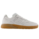 A side profile view displays the 933 WWB White Black Andrew Reynolds New Balance Numeric Suede Skateboarding Shoe, featuring a white upper with a gum sole and an ABZORB midsole for enhanced cushioning, set against a plain white background.