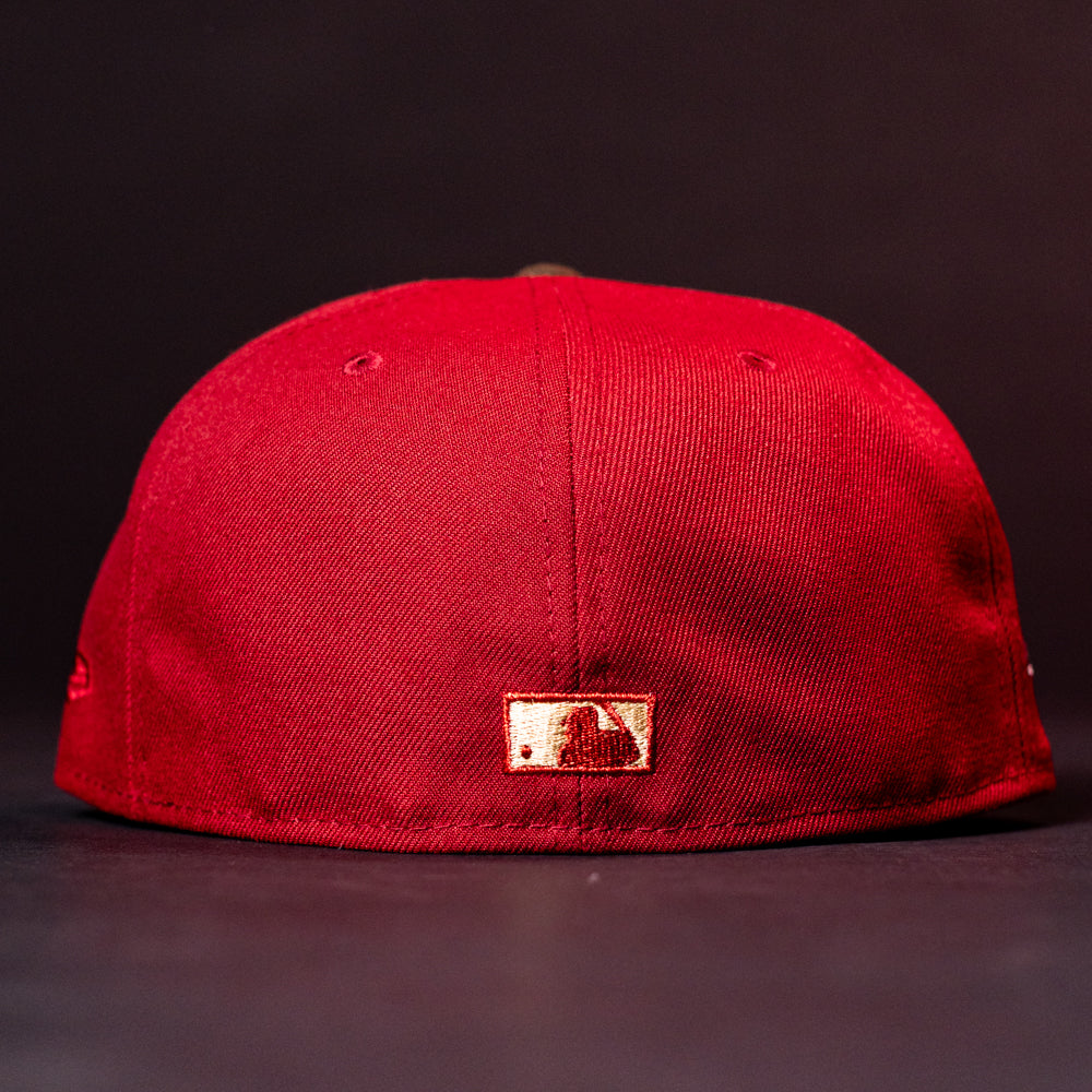 The ASG19 Bred Houston Astros New Era 5950 Fitted Hat is shown from the back, featuring a small gold embroidered logo near the bottom center against a dark, uncluttered background.
