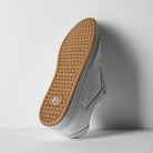 The Accel White Leather Es Shoes Skateboarding features a white upper with a tan, textured rubber sole and a small b logo near the heel—ideal for both streetwear and skateboarding style.