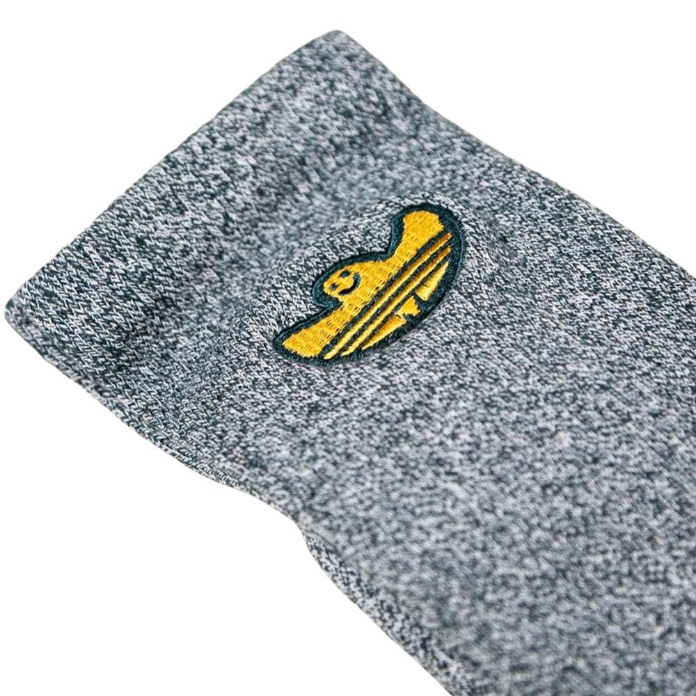 A close-up of the gray knit Gonz Art Sock KD3674 by Adidas Skateboarding, featuring a yellow and black embroidered sombrero.