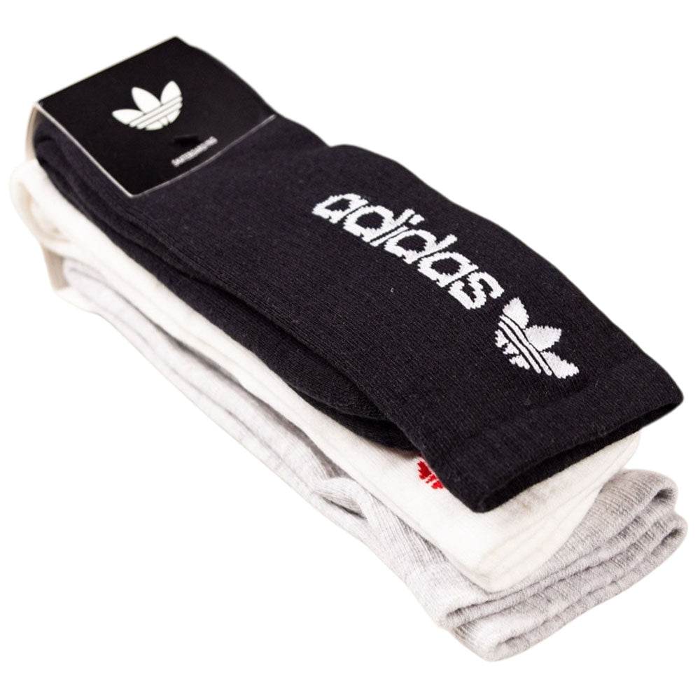 A pack of three FSBS Premium Sock KD3680 by Adidas Skateboarding in black, white, and grey, neatly stacked. The black sock on top displays the white Adidas logo with trefoil design.