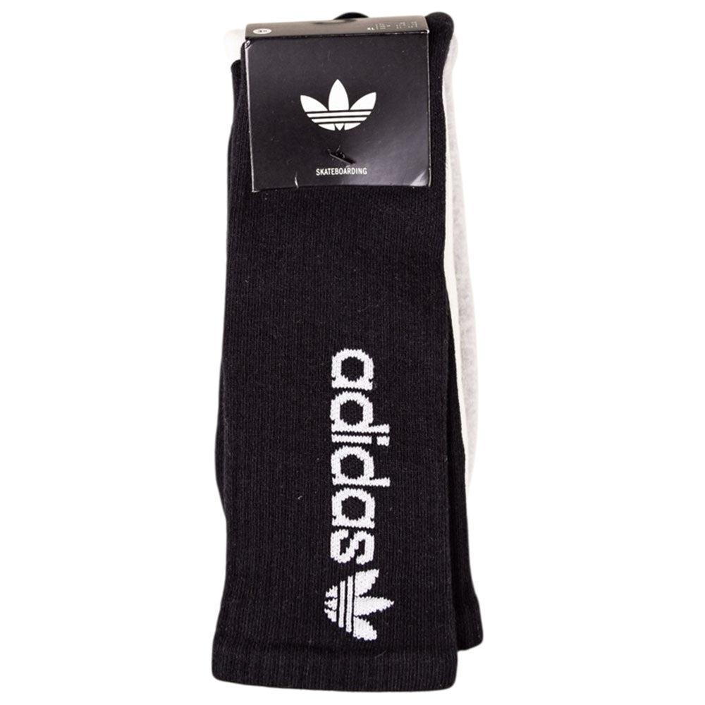 A pack of FSBS Premium Sock KD3680 Black, White, Grey (3 pairs) from Adidas Skateboarding, featuring the signature Adidas logo and vertical "adidas" branding, still attached to the packaging label.