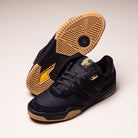 The KJ5054 Cordura Carbon Black Tekkira Cup Adidas Skateboarding suede shoes are shown: one displays the side and suede upper, while the other reveals the textured gum sole with yellow detailing.