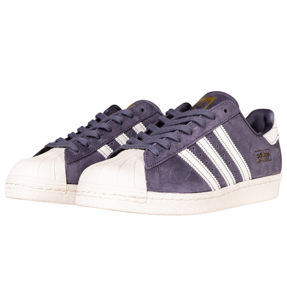 A pair of Grey White Superstar 80 ADV HQ9289 Adidas Skateboarding Leather Shoes featuring classic white leather, durable rubber shells, and signature three stripes—ideal for skateboarding with timeless style.