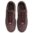 A pair of Air Force 1 Black Light Chocolate HM8517201 Nike SB suede skateboarding shoes are viewed from above, highlighting their laces, perforated toe boxes, and Nike SB logos on the tongues. Inspired by the classic Nike SB Air Force 1 design, these premium skate shoes also feature signature Nike Air cushioning for all-day comfort.