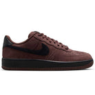The Air Force 1 Black Light Chocolate HM8517201 Nike SB Suede Skateboarding Shoe features a brown suede upper with a black swoosh, heel, and sole, along with signature Nike Air cushioning for enhanced comfort. This stylish skate shoe is shown in a side profile against a plain white background.