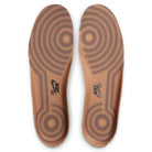A pair of brown Nike SB insoles with black concentric circles, designed for the Air Force 1 Flax Black Gum Light Brown HM8517200 Suede Skateboarding Shoes, featuring a black Nike SB logo near the heel.