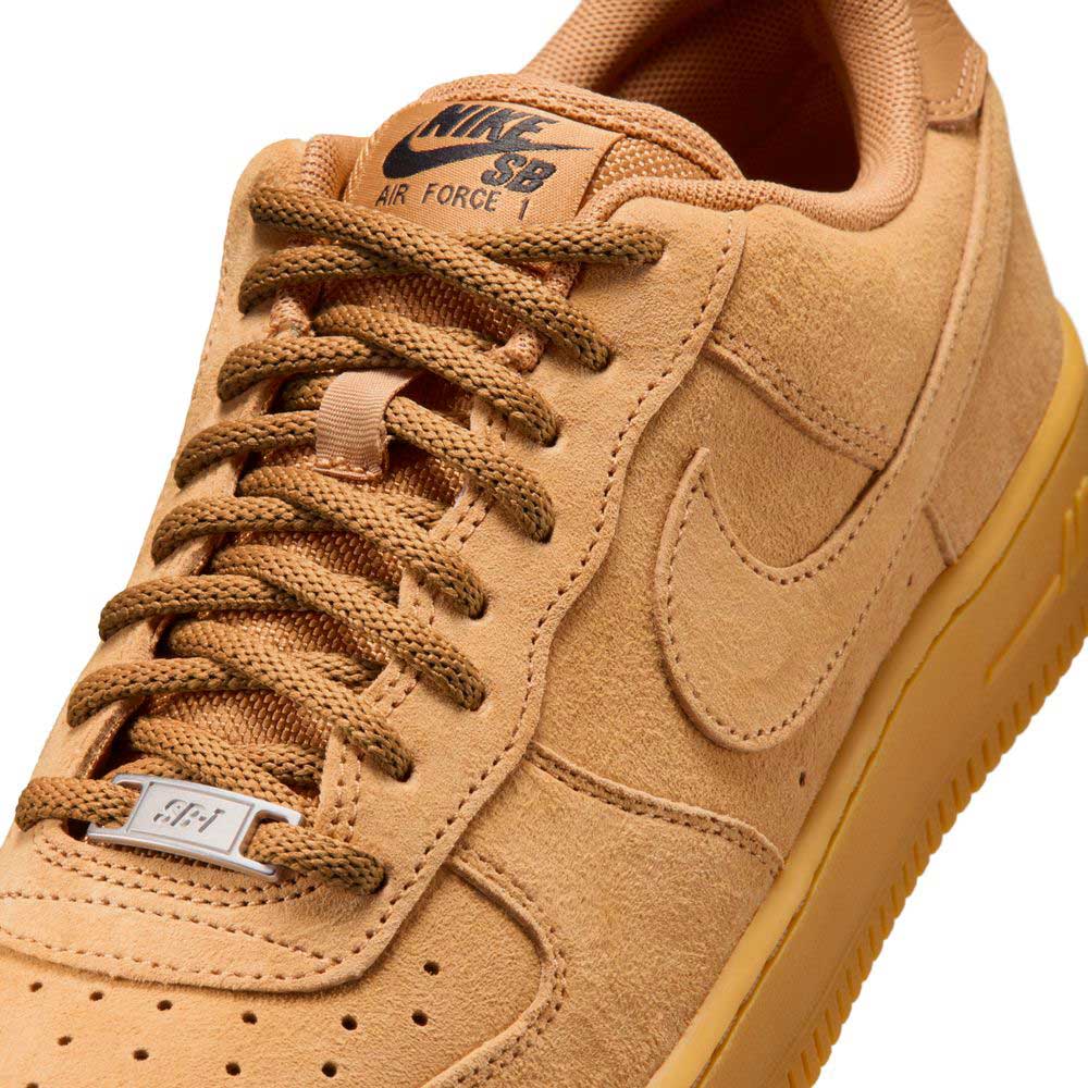 Close-up of the Air Force 1 Flax Black Gum Light Brown HM8517200 Nike SB Suede Skateboarding Shoe, featuring tan suede, matching laces, a textured Swoosh, AF1 lace tag, Nike Air cushioning, gum sole, and visible stitching.