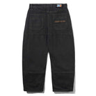 The Aleka Denim Jeans Flat Black Cash Only COD153202 are black workwear-style pants, seen from the back, with two large back pockets, a Carhartt patch above the right pocket, and a loose straight-leg fit.