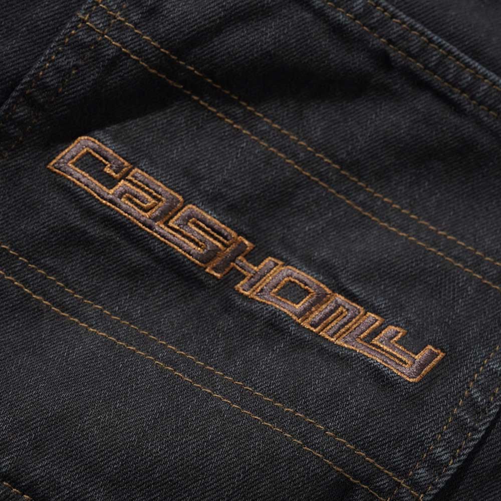 Close-up of Aleka Denim Jeans Flat Black Cash Only COD153202, showing black fabric with bold orange "CASHONLY" embroidery and orange stitching in a modern font.