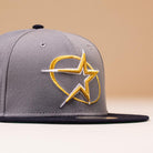 The Gray Navy Circle Star Houston Astros New Era 5950 Fitted Hat features a sleek design with star embroidery on the front, perfect for fans and ideal for batting practice.