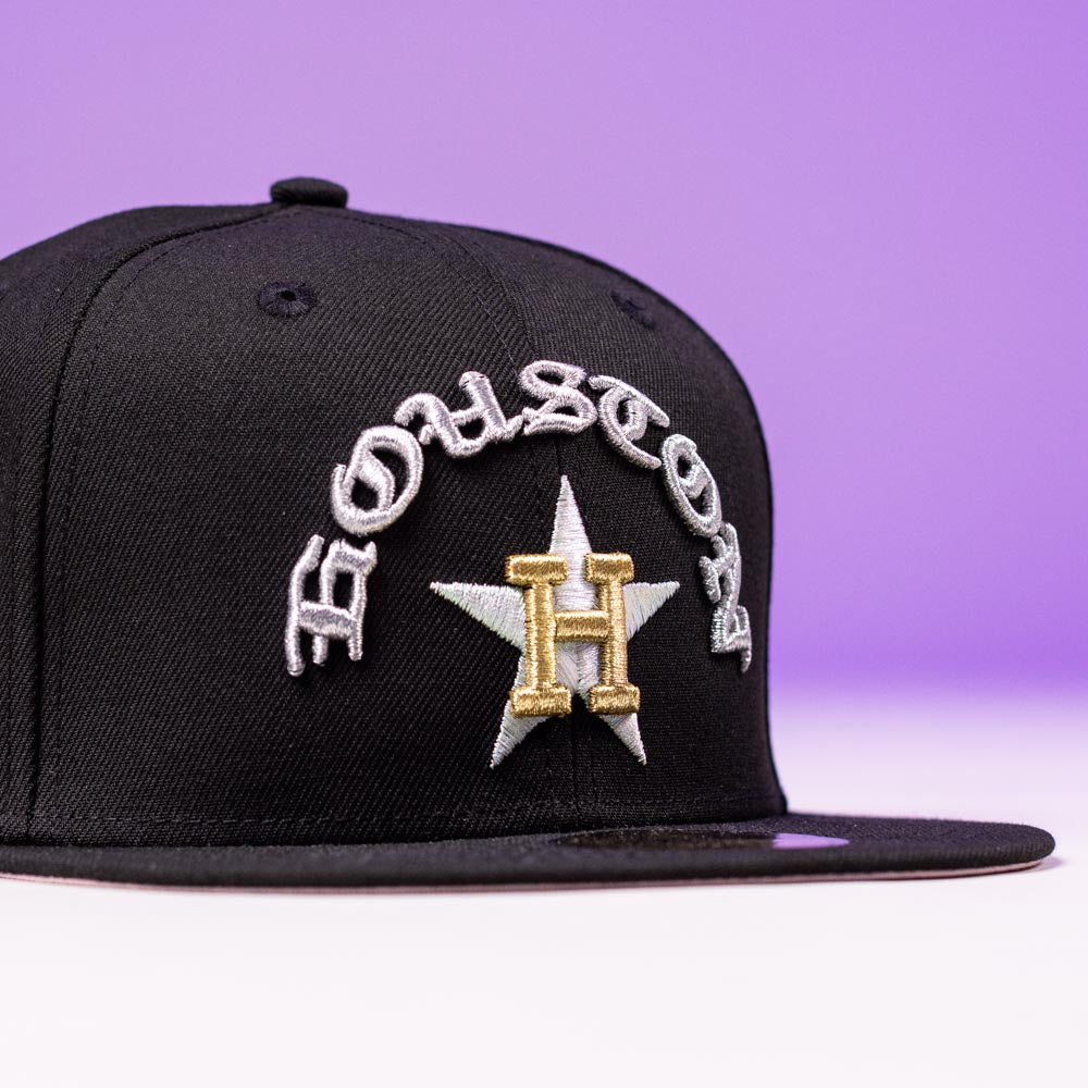 The Summer Nights Trilogy Houston Astros New Era 5950 Fitted Hat features a black and gold design with HOUSTON in white, a gold H, white and gold star, and purple accents—perfect for any Astros fan.