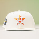 The Summer Days 2022 Houston Astros New Era Hat 5950 Day features the team’s logo with an orange star and white H on the front, a 2022 World Series patch on the side, and comes in white.