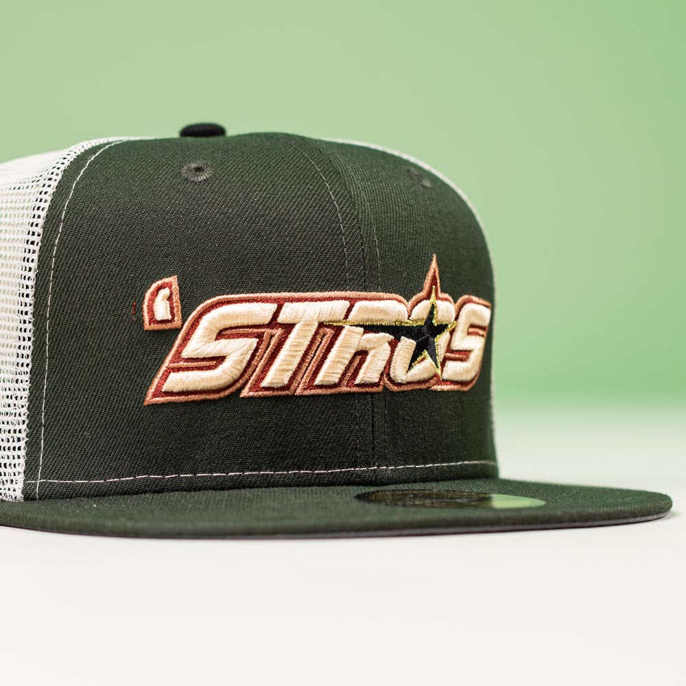 A black and white mesh El Jimador Stone Houston Astros New Era 5950 Fitted hat featuring "STROS" in orange/yellow embroidery with a star on a green background—perfect for Whatafitted style fans.