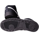 A pair of Japan Pro MT Asics Black Bright White 1201B003003 suede skateboarding shoes, with one shoe on its side and the other showing the textured tread and ASICS logo on the sole.