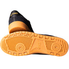 A pair of Japan Pro Asics Black Tan Presido 1201A920003 suede skateboarding shoes; one shoe shows the black upper, the other shows the tread with an orange sole and Asics logo.