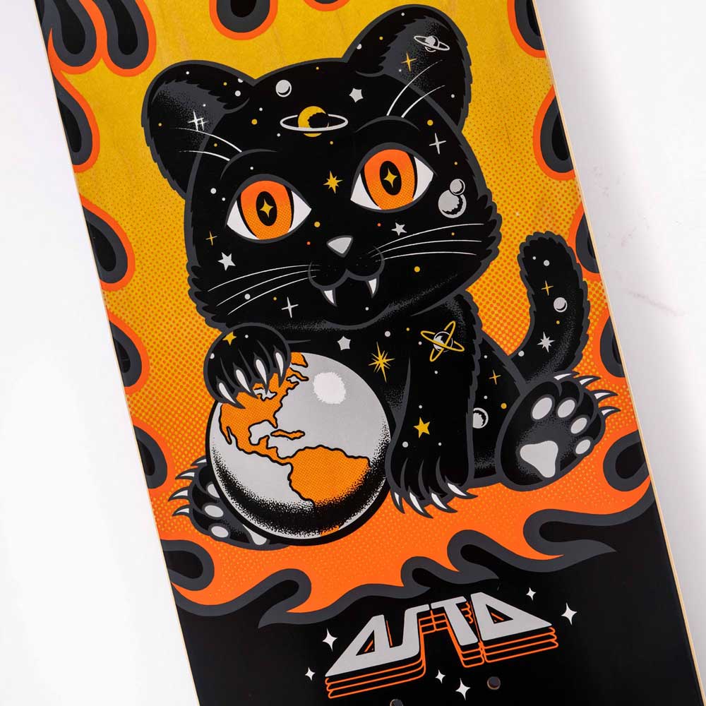 A cartoon black cat with orange eyes and cosmic details, inspired by Asta Space Kitten, sits holding an Earth-like planet amid flames on the Asta Space Kitten Twin Pro 8.2in x 31.6in Santa Cruz Skateboards Deck—ideal for skate style.