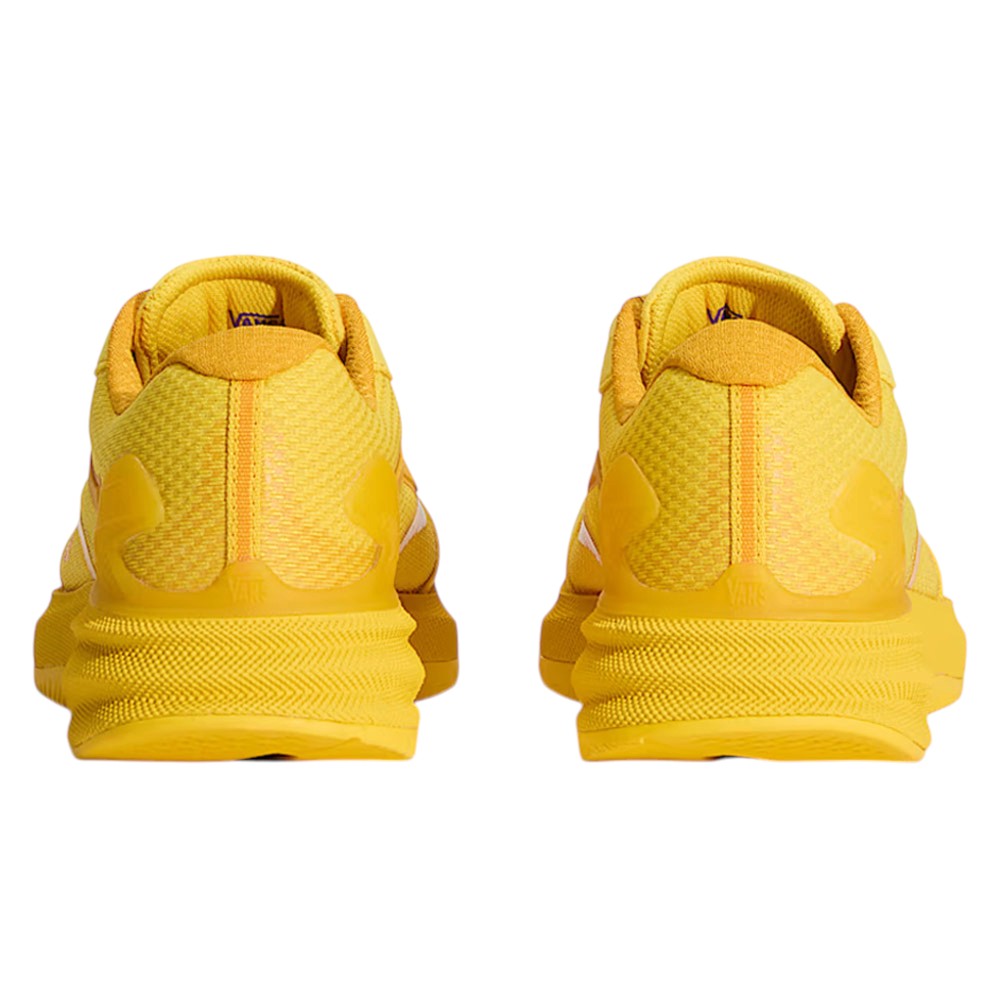 Rear view of a pair of yellow Atiba Vans AVE Rapid LX Gold VN000Y1MGLD Suede Skateboarding Shoes with textured midsoles.
