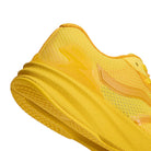 Close-up of a yellow Atiba Vans AVE Rapid LX Gold VN000Y1MGLD Suede Skateboarding Shoe, highlighting the textured heel, FeatherKnit construction, midsole, and branded heel overlay.