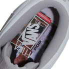Close-up of the interior of a light gray Atiba Vans Skate Half Cab Light Gray VN0A5FCDBH71 Suede Skateboarding Shoe, showing the branded insole with a camouflage pattern.