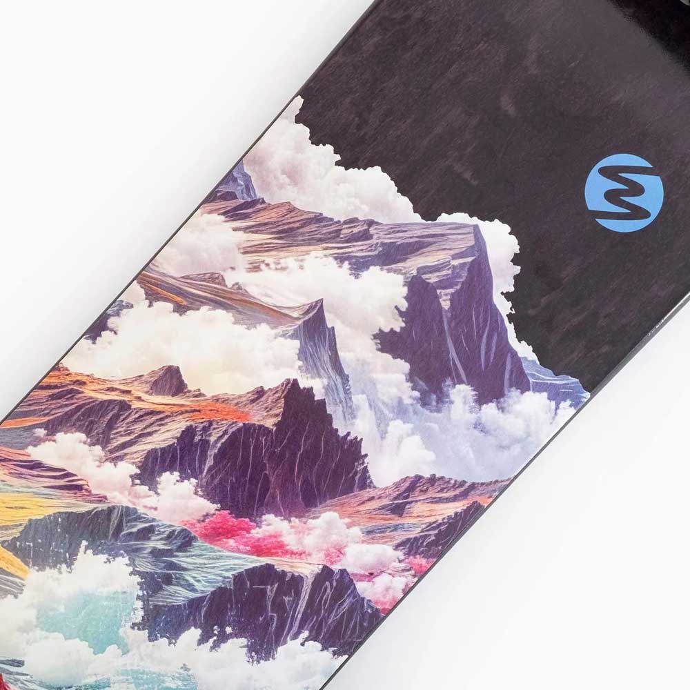 A close-up of the Atmosphere Switchblade 40 Landyachtz Complete Skateboard, showcasing a vibrant mountain landscape and clouds graphic with a blue stylized S logo near the top right, similar to designs seen on freeride longboards.