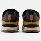 Rear view of Baked Clay Black 1010 LV New Balance Numeric suede skateboarding shoes, featuring brown suede, black mesh accents, orange and white zigzag stitching, beige soles, and pro-level skate shoe performance.